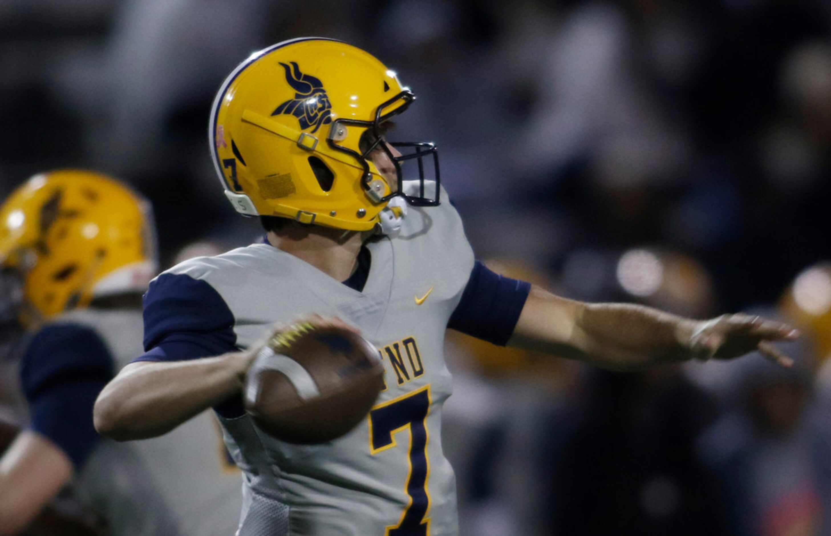 Arlington Lamar quarterback Jack Dawson (7) launches a pass during first quarter action...