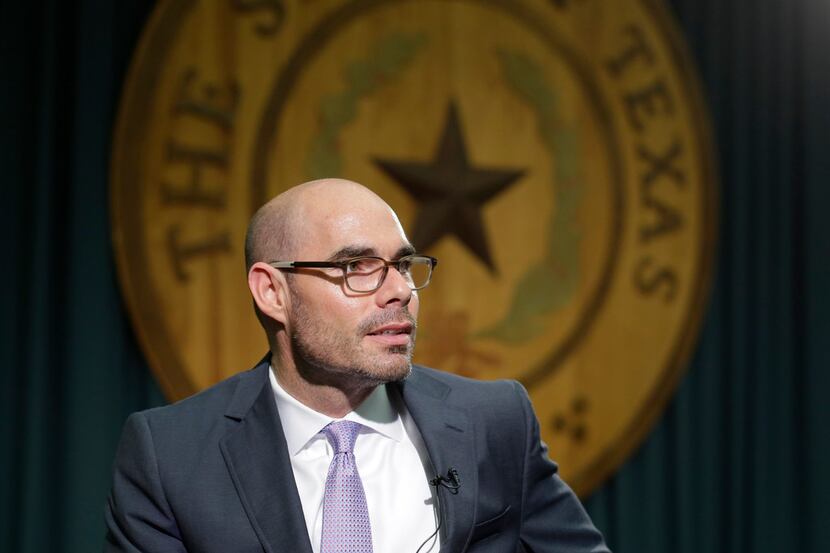 In this May 15, 2015, file photo, Texas Rep. Dennis Bonnen, R-Angleton, talks to the media...