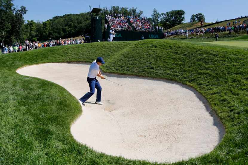Jordan Spieth hits out of the bunker on the sixth hole during the rain delayed second round...