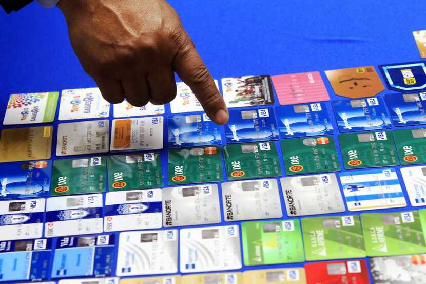 McAllen Police Chief Victor Rodriguez displayed dozens of fraudulent credit cards that were...