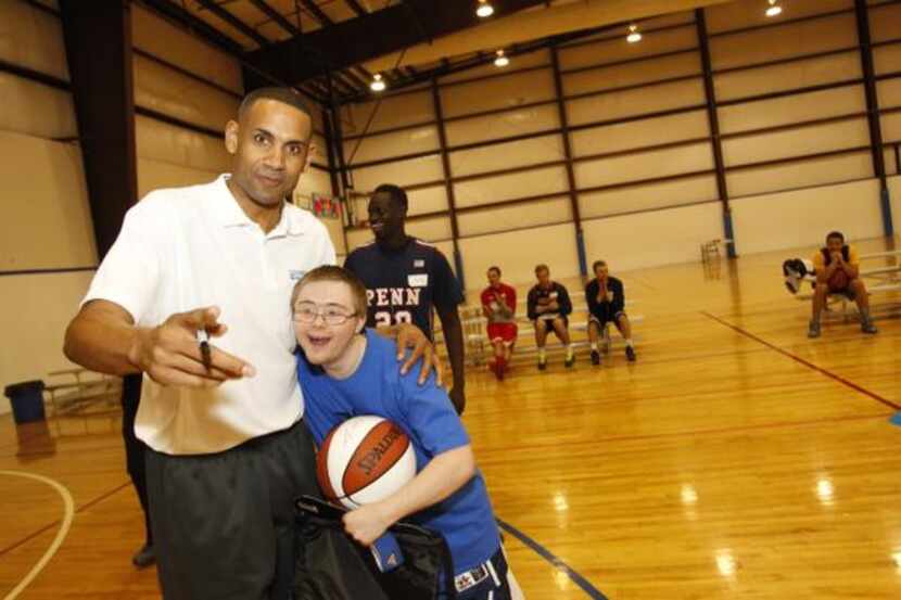 GRANT HILL , a former NBA star, coached special-needs kids in a basketball camp in Dallas as...