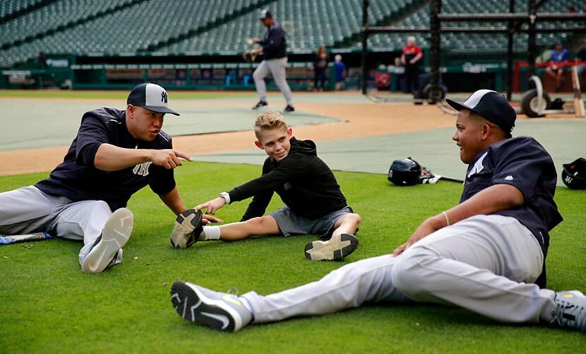  Tracen Visage chats with New York Yankees outfielder Carlos Beltran (left) and catcher...