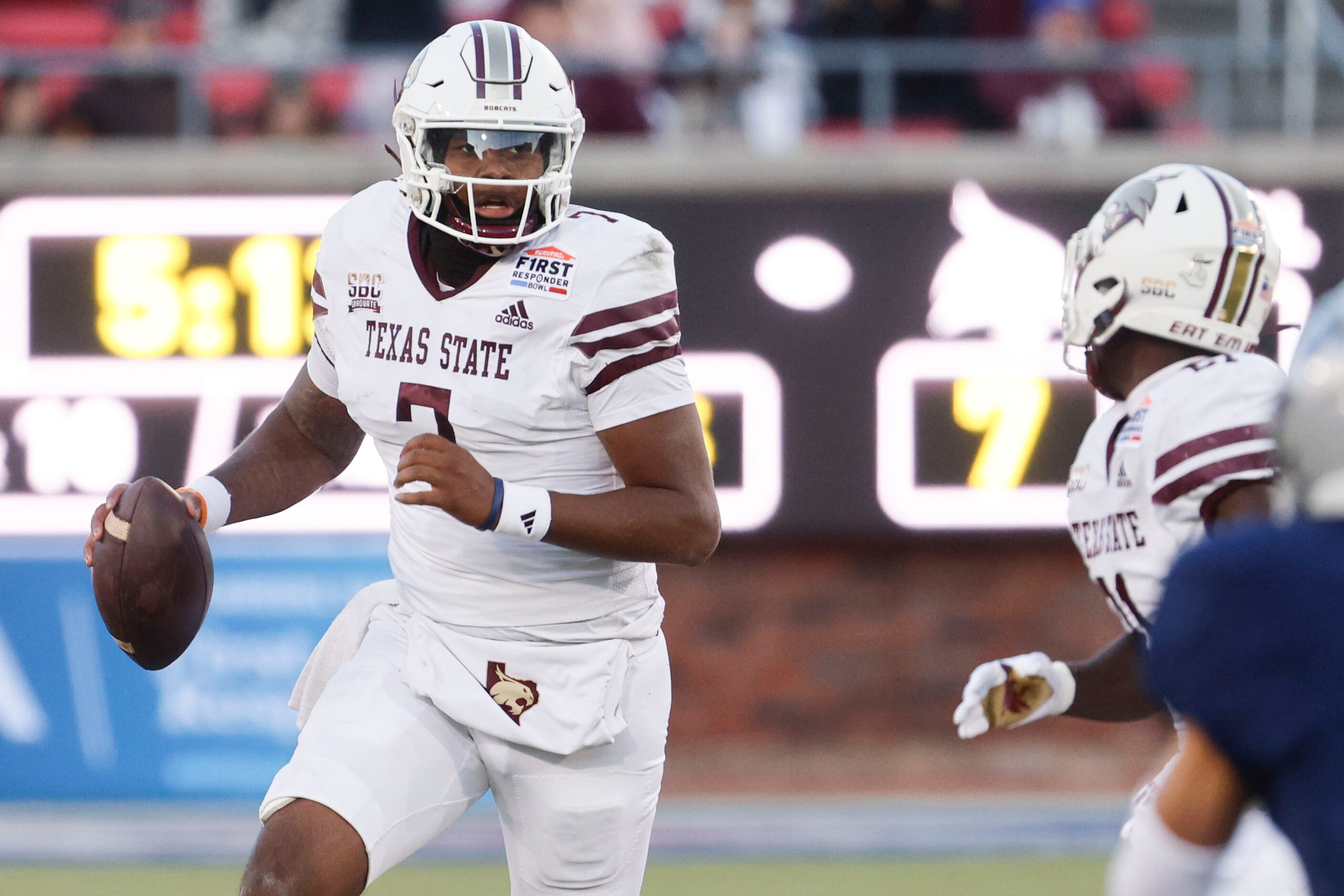 Texas State quarterback TJ Finley (7) looks to pass the ball against the Rice during the...