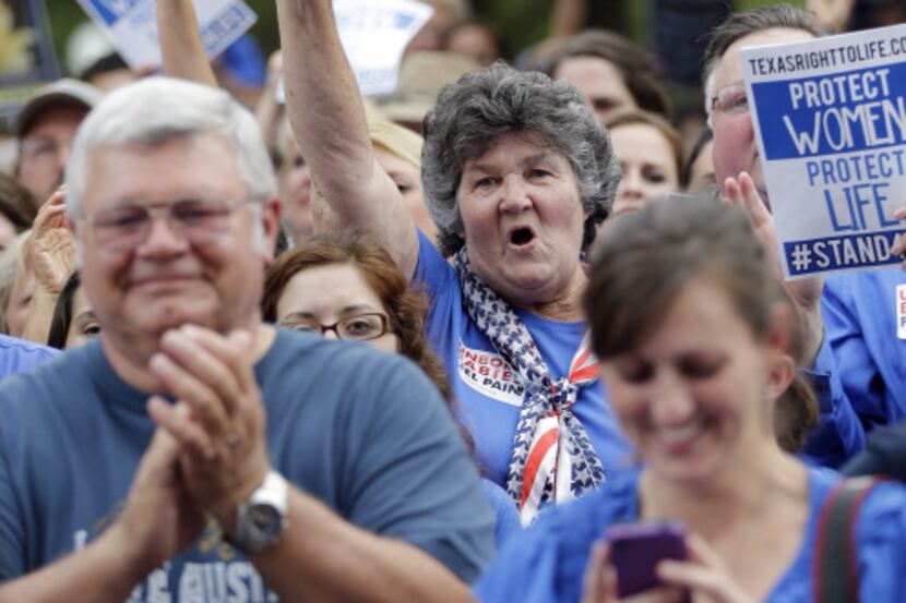 Abortion opponents cheered during a rally at the Capitol on Monday, as a public hearing on...