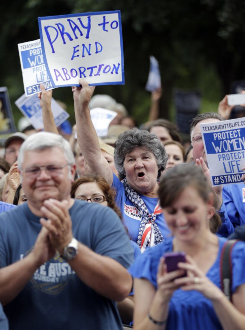 Abortion opponents cheered during a rally at the Capitol on Monday, as a public hearing on...