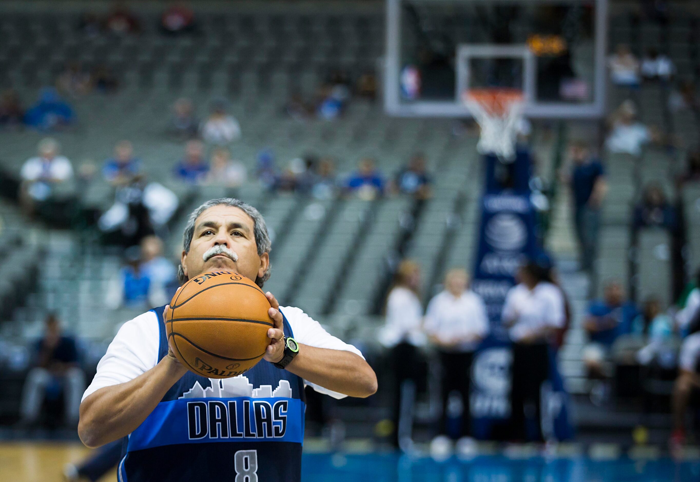 DISD superintended Dr. Michael Hinojosa shoots baskets on the floor before the first half of...