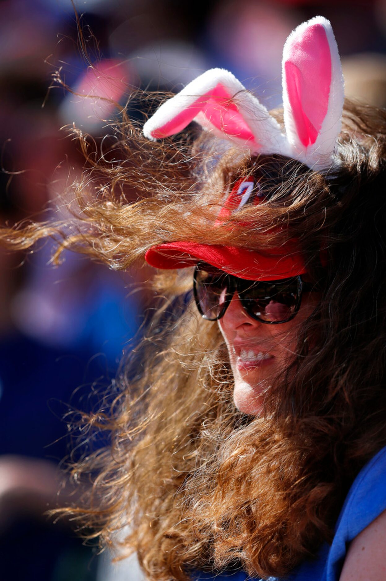 The swirling winds in Globe Life Field caused havoc for Carie McDonald of Coppell, Texas as...