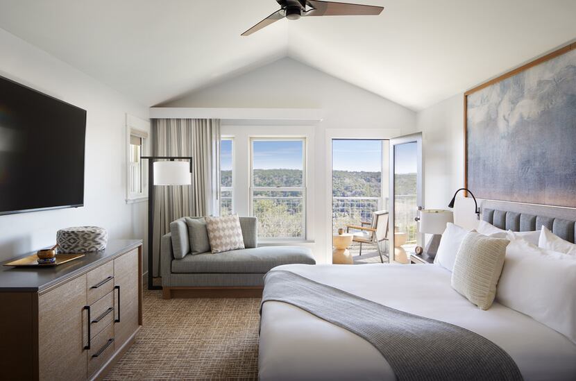 A king bedroom at Miraval Austin is outfitted in peaceful neutral tones, with beds that you...