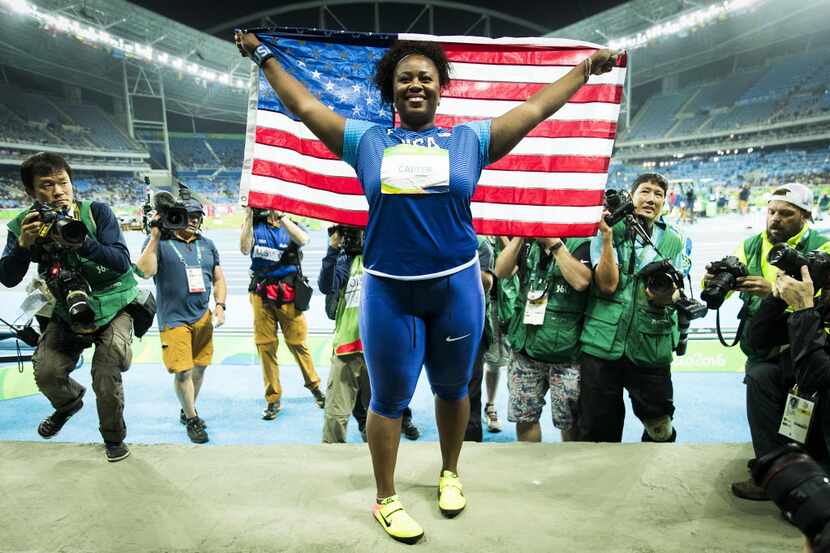 Red Oak's Michelle Carter celebrates after winning the women's shot put gold medal on the...