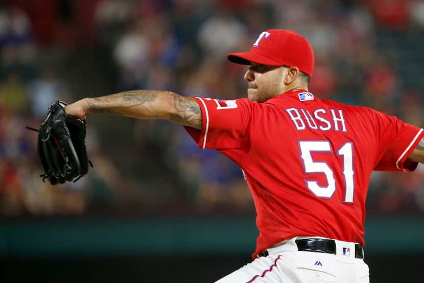 Texas Rangers relief pitcher Matt Bush throws a pitch against Oakland Athletics during the...