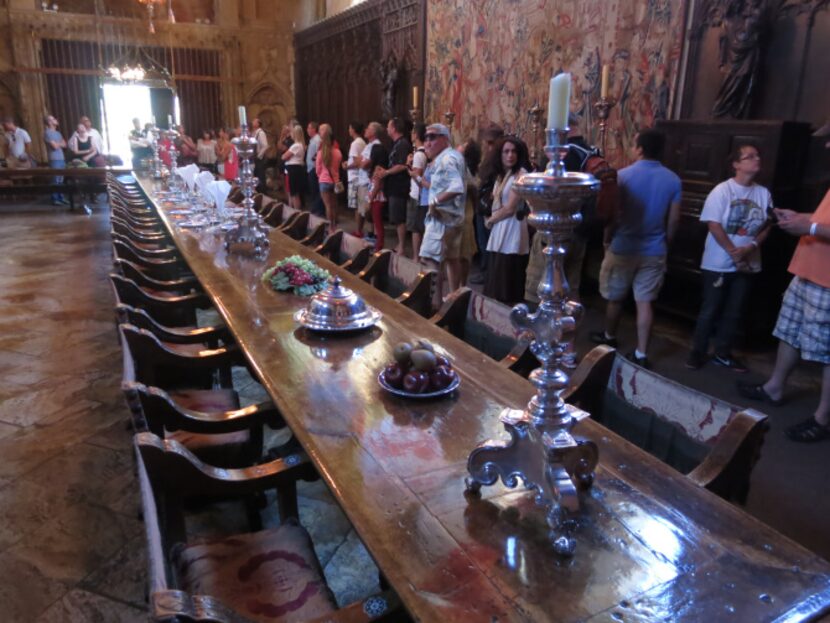 Visitors tour the dining room of newspaper publisher William Randolph Hearst's 165-room estate.