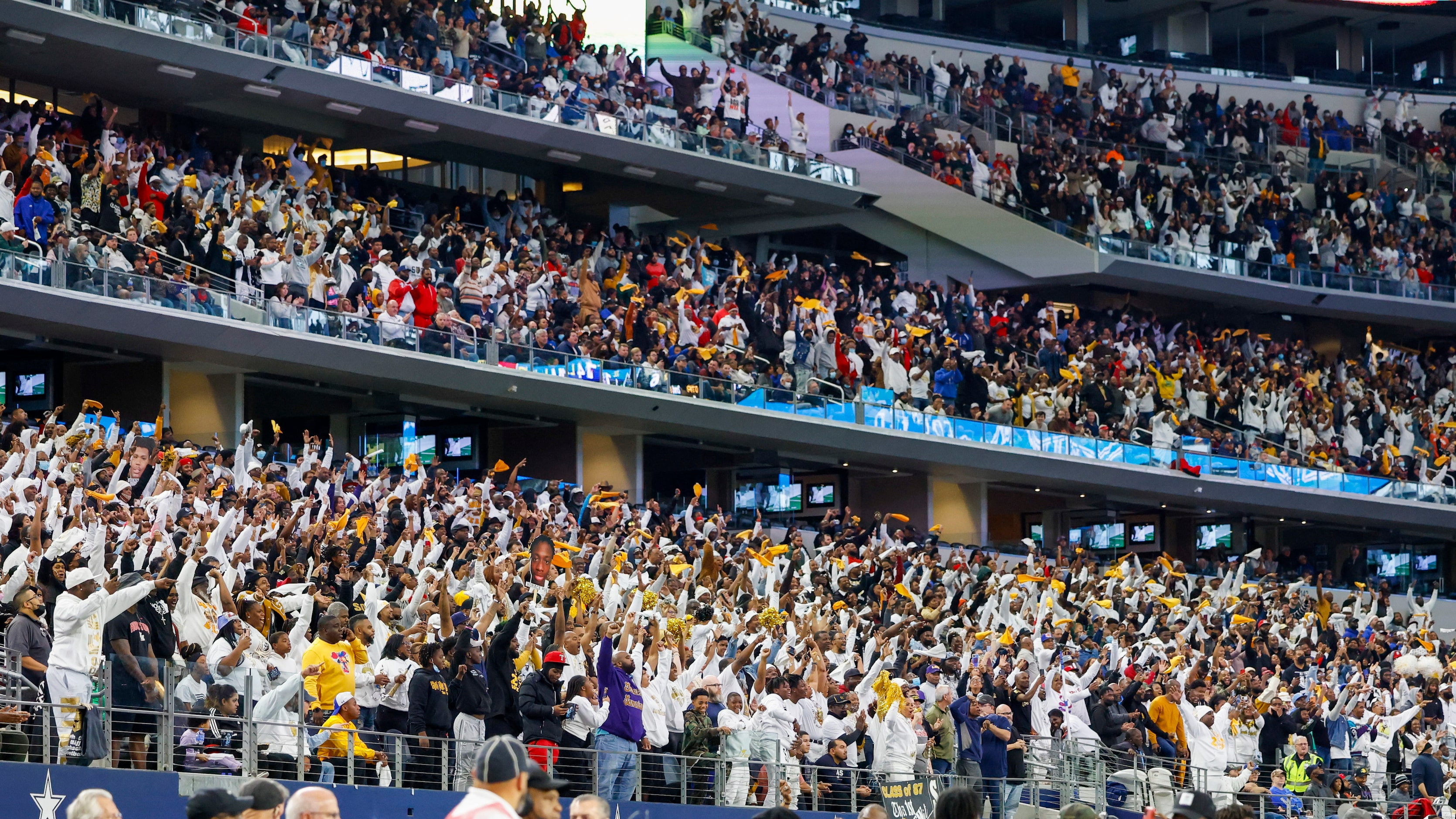 South Oak Cliff fans stand and cheer during the fourth quarter of their Class 5A Division II...