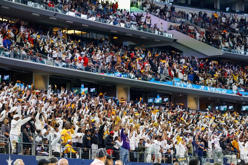 South Oak Cliff fans stand and cheer during the fourth quarter of their Class 5A Division II...