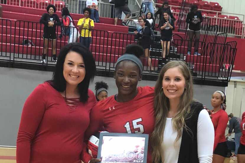 South Grand Prairie senior outside hitter Azhani Tealer  receives a plaque before a recent...