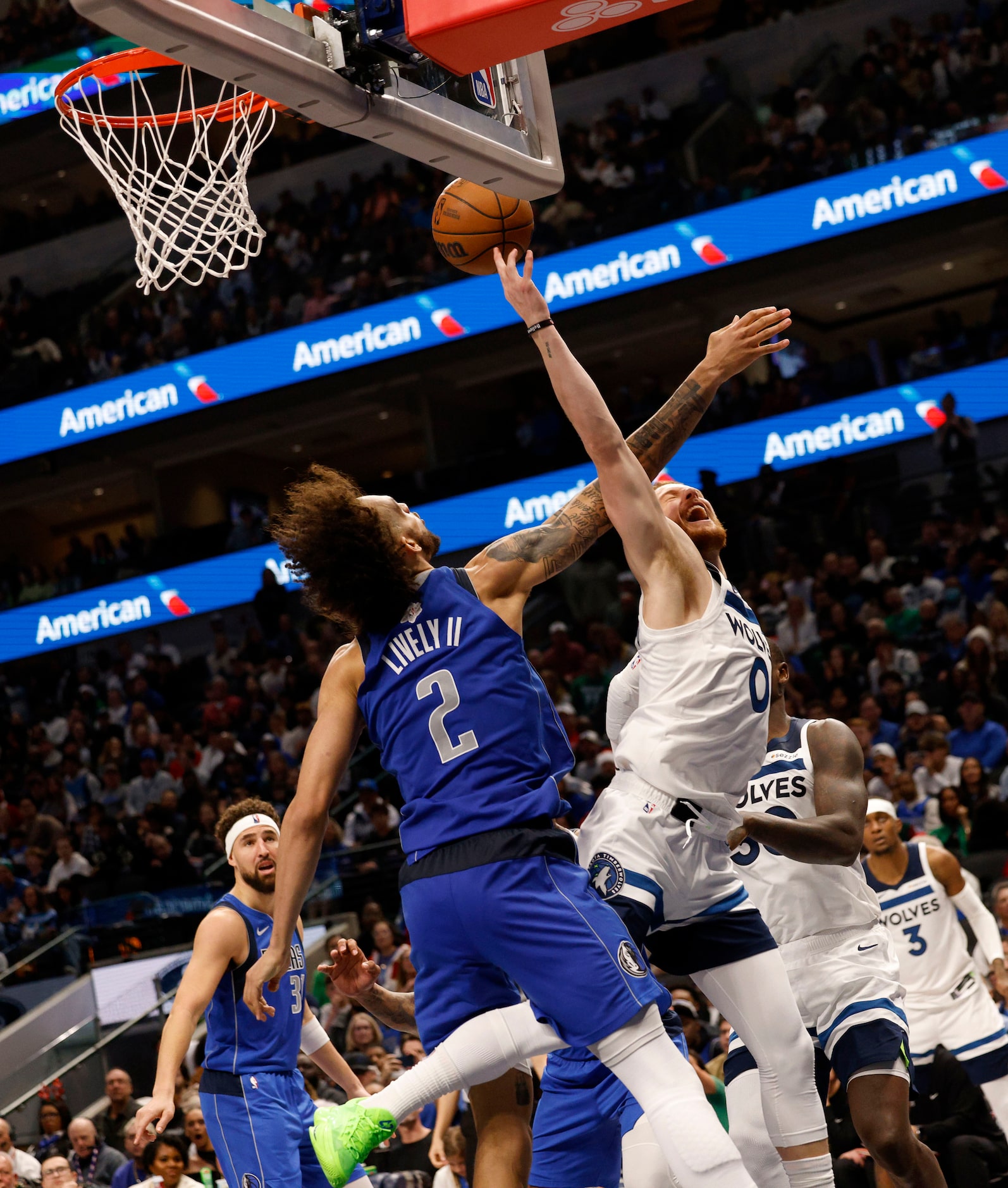 Dallas Mavericks center Dereck Lively II (2) defends as Minnesota Timberwolves guard Donte...