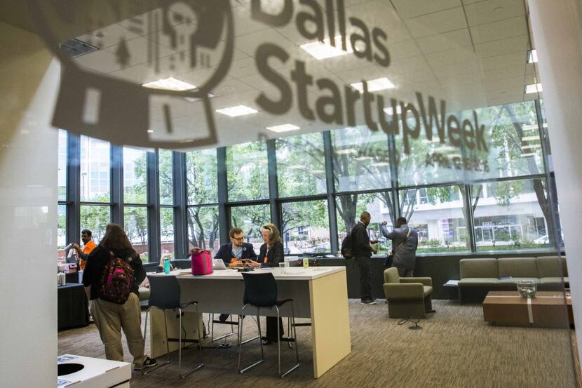 Participants work in a lounge area during Dallas Startup Week activities in April.  (Ashley...