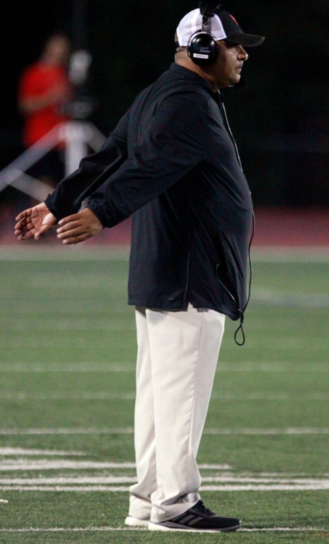 North Garland football coach Joe Castillo paces the sideline during the first half of the...