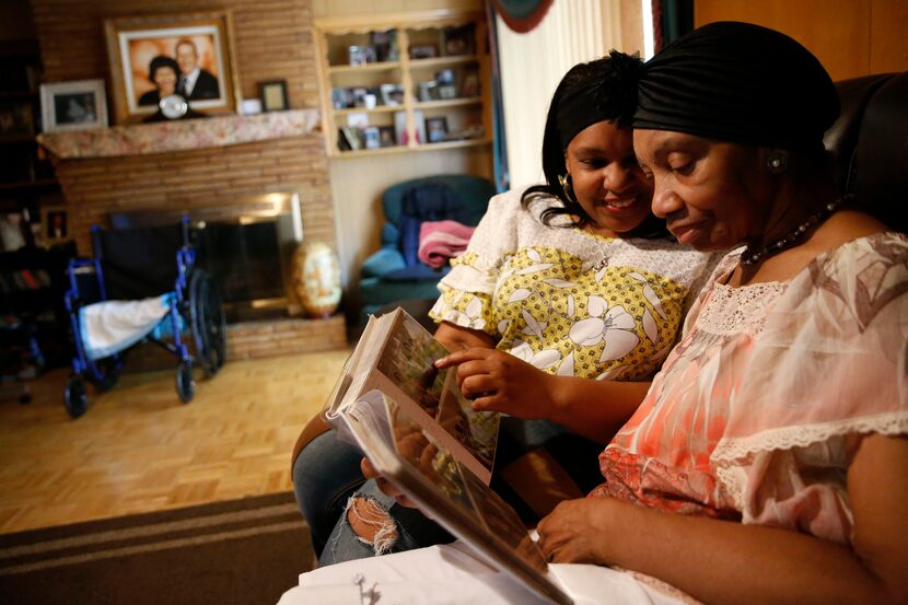 Jennifer Greer (left) looks through a photo album with her mother, Carolyn Greer. Jennifer...