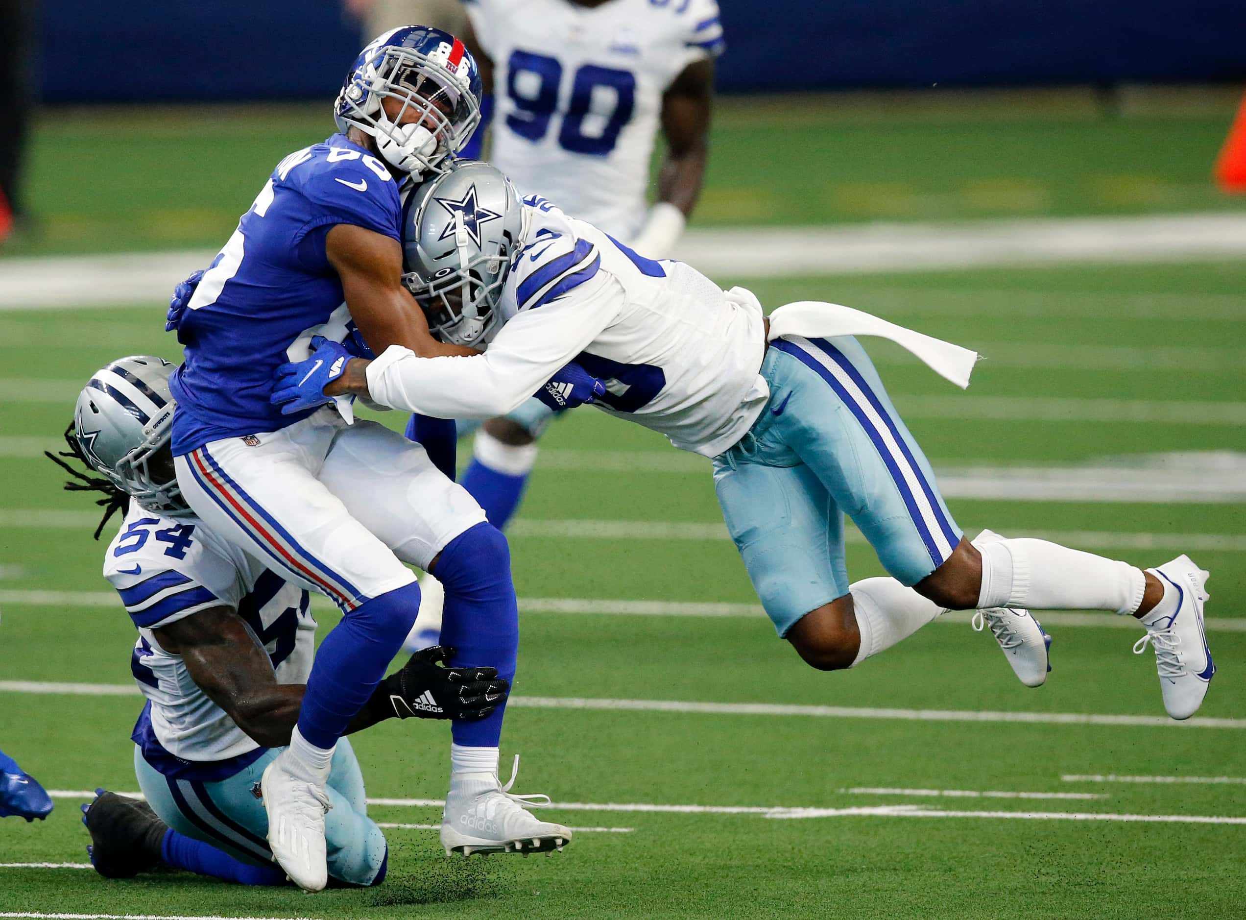 Dallas Cowboys defensive back Steven Parker (40) makes a flying tackle of New York Giants...