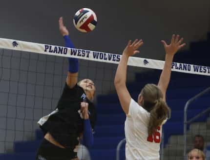 Kate Mansfield (10), left, from Plano West, fires a shot against the defense of Flower Mound...