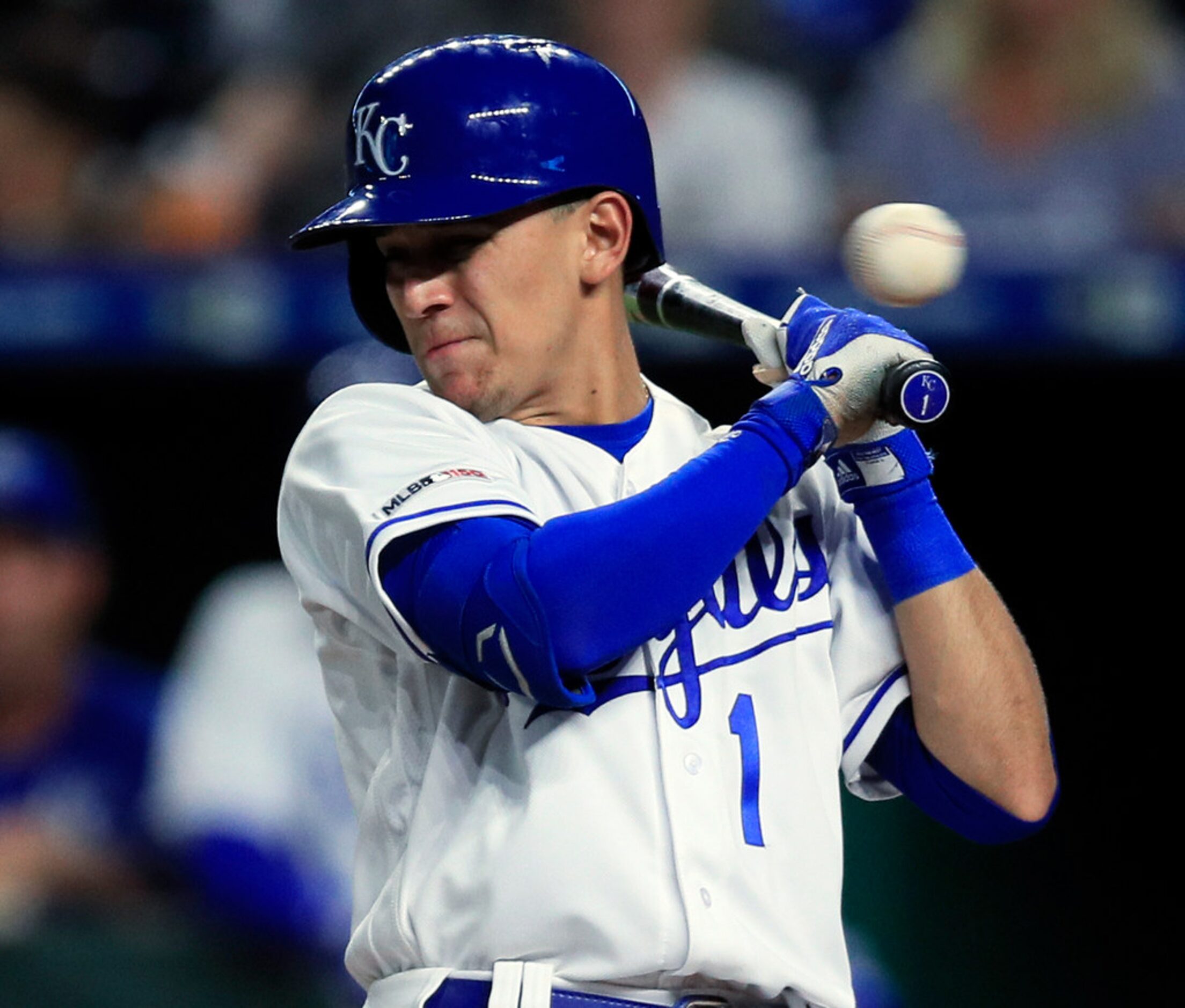 Kansas City Royals' Nicky Lopez dodges an inside pitch from the Texas Rangers during the...