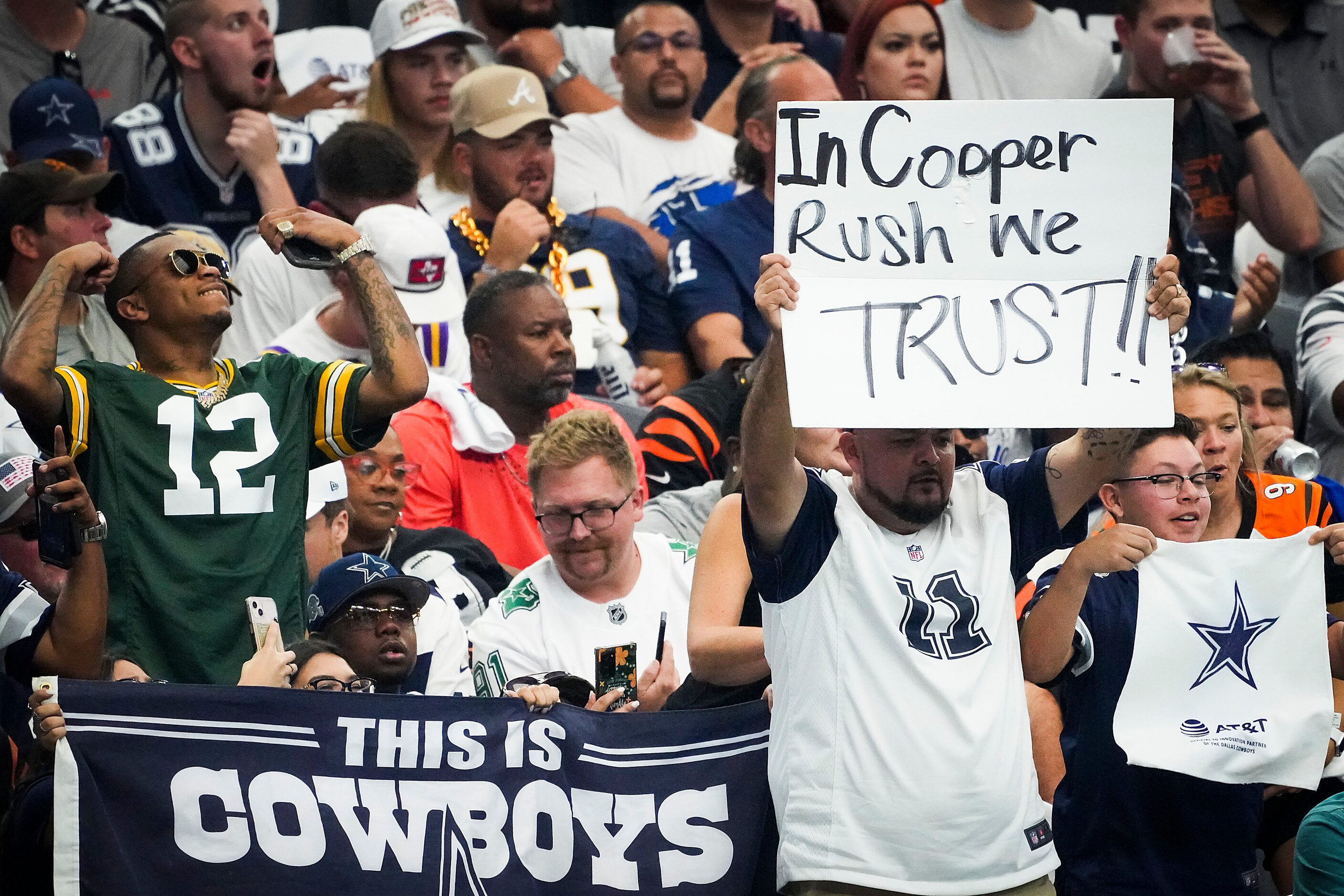 Dallas Cowboys fans cheer for quarterback Cooper Rush during the first half of an NFL...