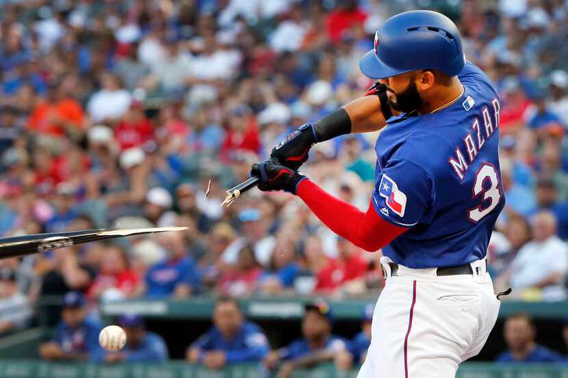 Texas Rangers right fielder Nomar Mazara (30) breaks his bat on a pitch by the Houston...