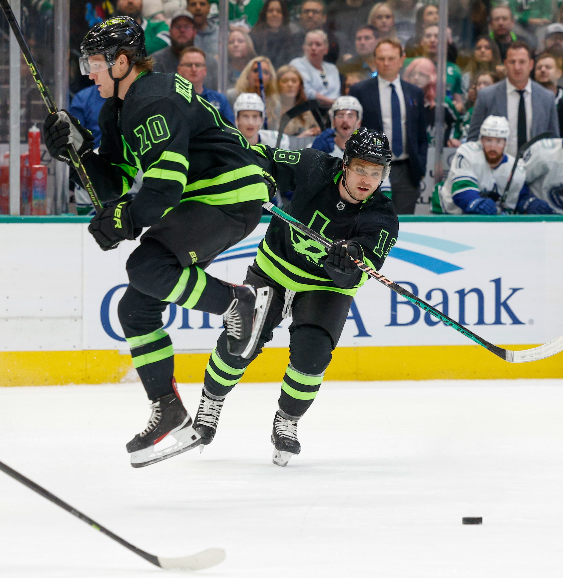 Dallas Stars center Ty Dellandrea (10) jumps over a pass from center Max Domi (18) during...