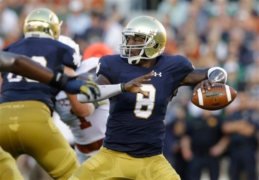 FILE - In this Sept. 5, 2015, file photo, Notre Dame quarterback Malik Zaire looks to a pass...