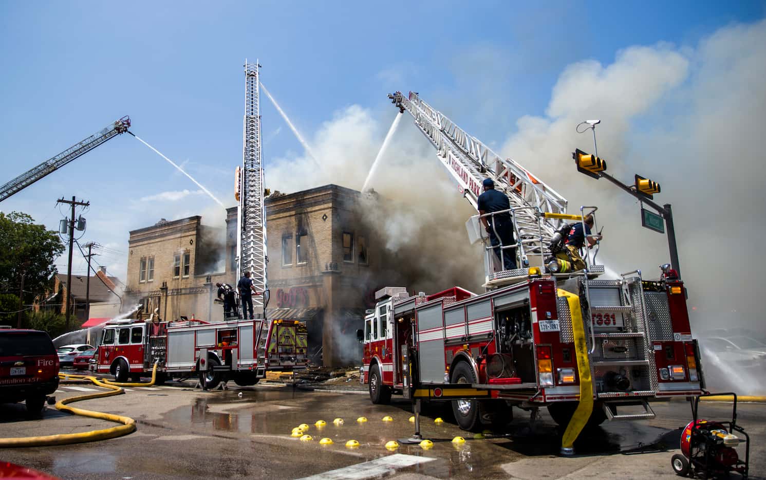 Firefighters battled flames Friday at Goff's Hamburgers on Hillcrest Avenue near the SMU...