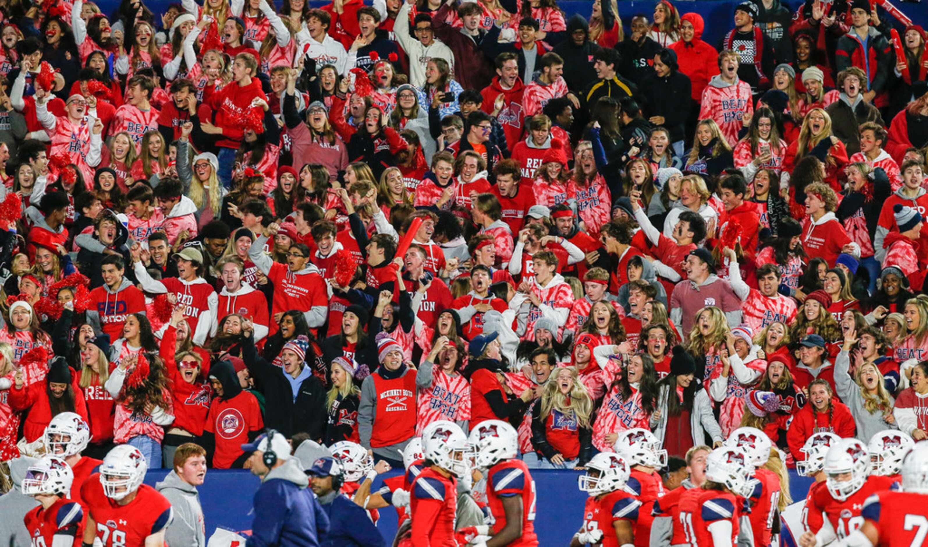 The McKinney Boyd student section celebrates a touchdown by Ja Tyler Shaw, not pictured,...