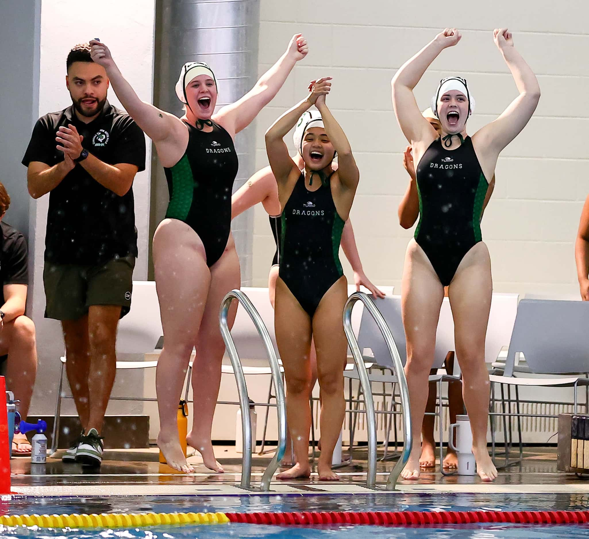 Southlake Carroll bench celebrate their victory over Hebron in the 6A Region I girls water...