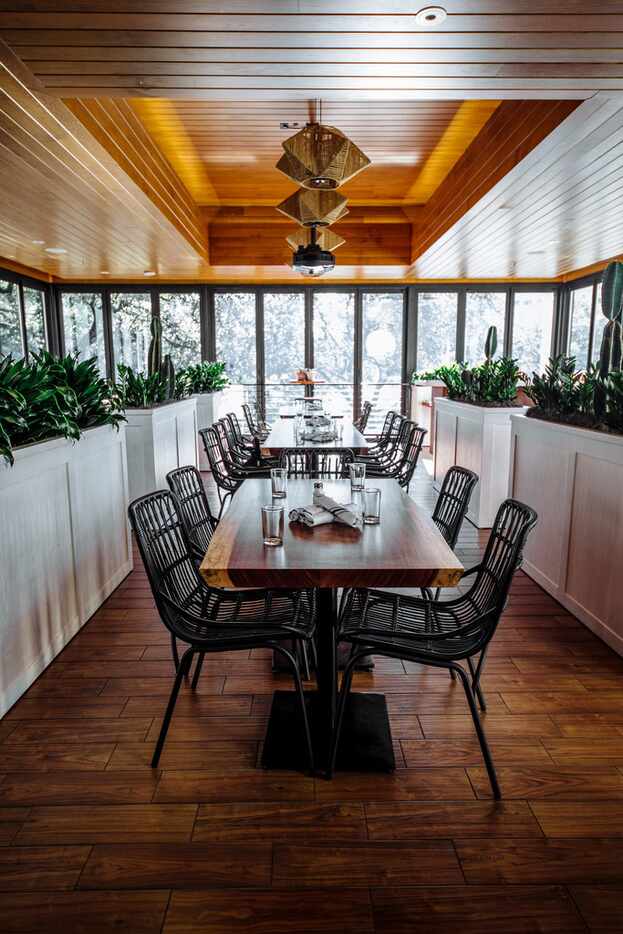 Floor-to-ceiling windows give the space a tree house vibe.