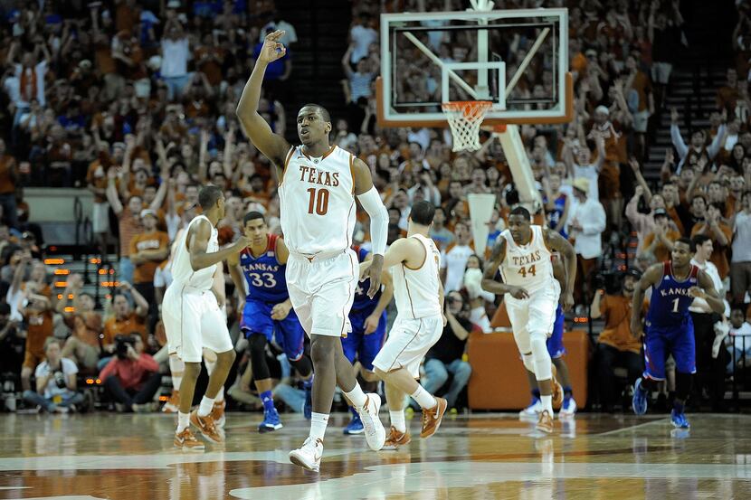 Texas' Jonathan Holmes gestures after hitting a three-point shot against Kansas at Austin's...