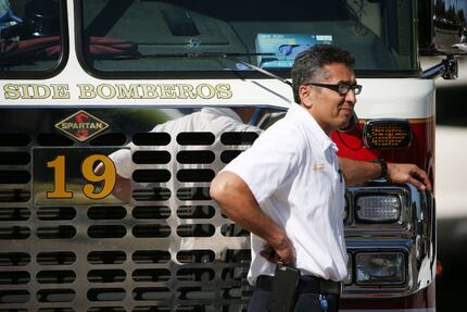 Personnel leans on Dallas Fire-Rescue engine 19 outside of the Baylor University Medical...
