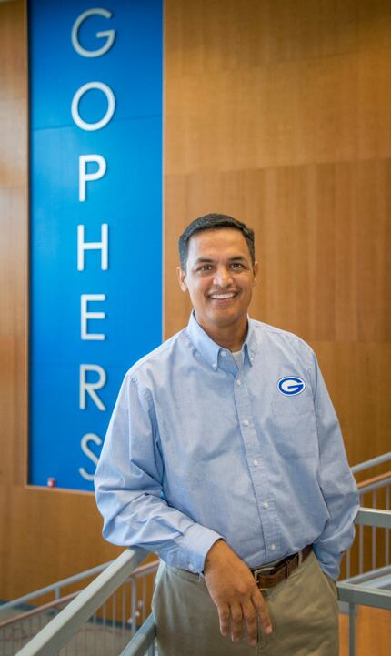 Grand Prairie High School Principal Lorimer Arendse poses in the foyer of the new four-story...