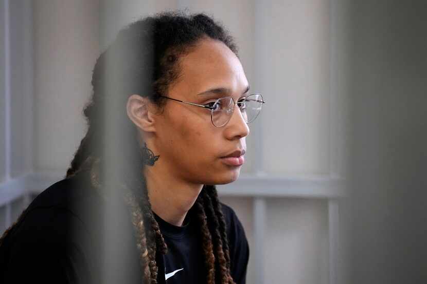 WNBA star and two-time Olympic gold medalist Brittney Griner sits in a cage at a court room...