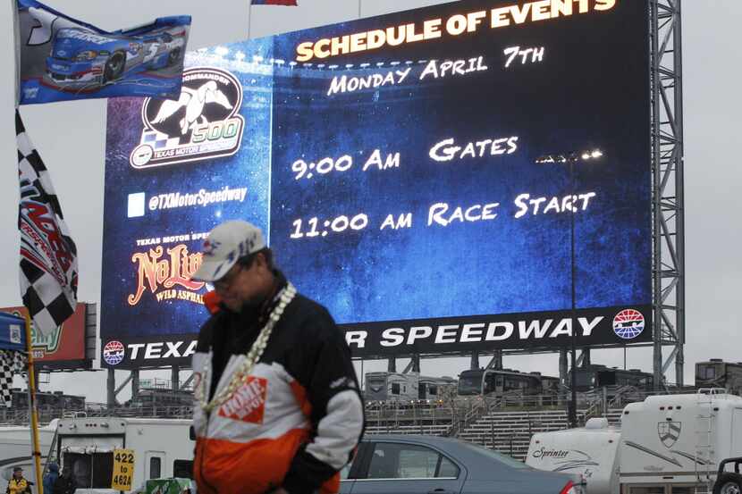 The giant TV screen announces the postponement of the NASCAR Sprint Cup Series auto race...