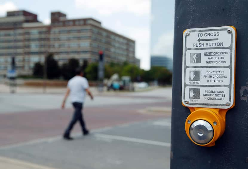 Push button for crosswalk signal in downtown Dallas on Tuesday, August 13, 2019. (Vernon...