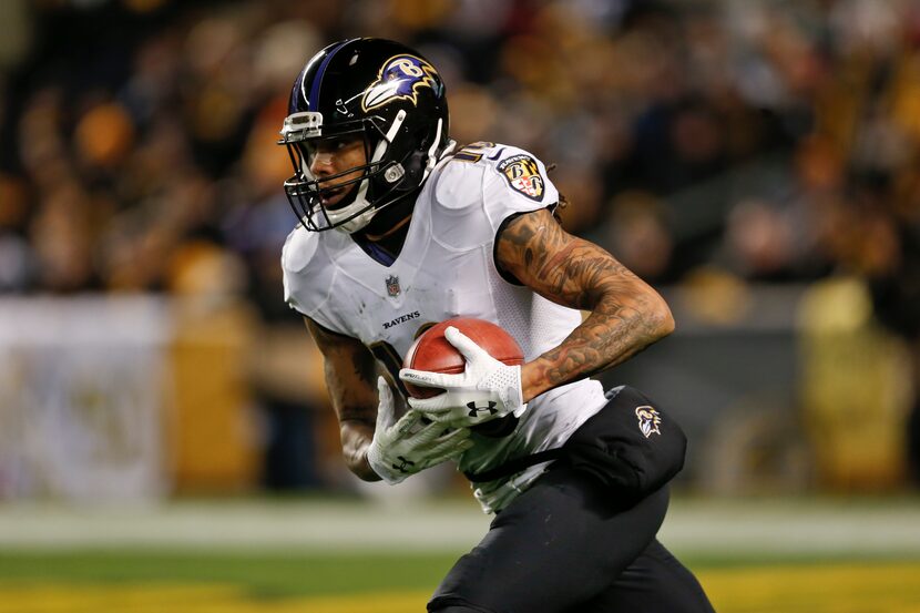 FILE - Baltimore Ravens' Chris Moore (10) returns a kickoff during an NFL football game...