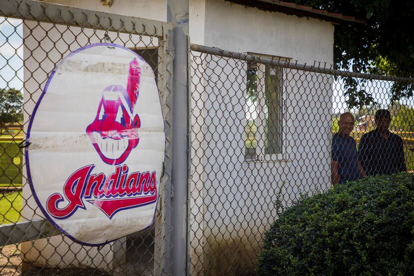 A weathered Cleveland Indians logo is the only sign of the baseball complexes behind the...