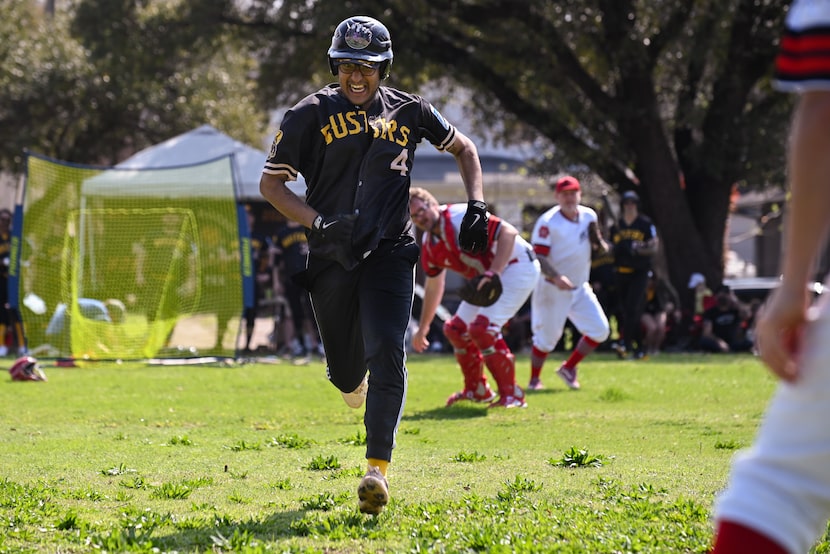 River City Honey Busters Alex Mireles runs toward first after a short infield hit as Oak...