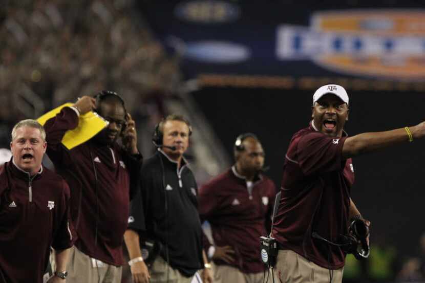 Texas A&M Aggies head coach Kevin Sumlin protests to the ref in the second quarter as the...