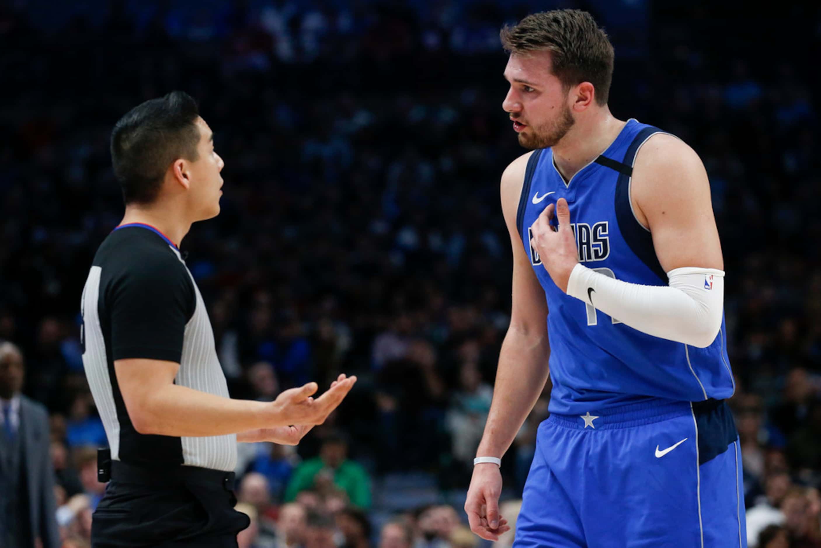 Dallas Mavericks forward Luka Doncic (77) argues a call by referee Evan Scott during the...