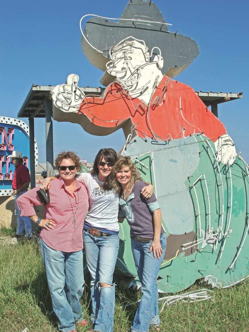 What will the Junk Gypsies do with their 12-foot neon cowboy? Who knows, but they had to...