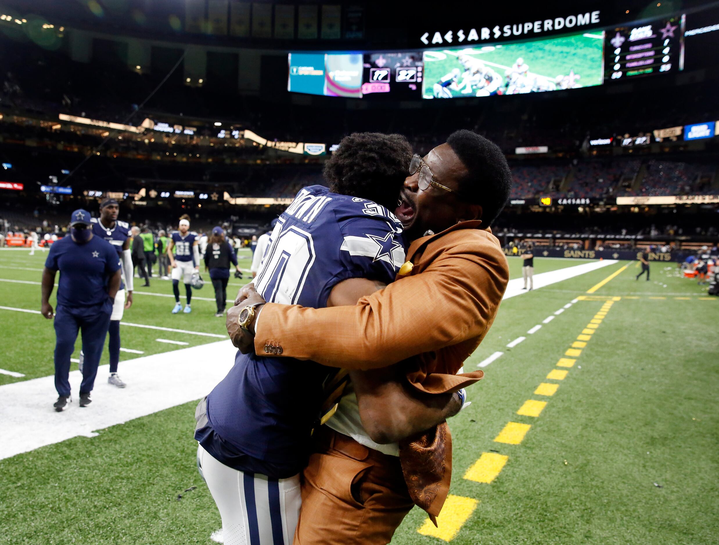 Dallas Cowboys Hall of Famer Michael Irvin congratulates Dallas Cowboys running back Tony...