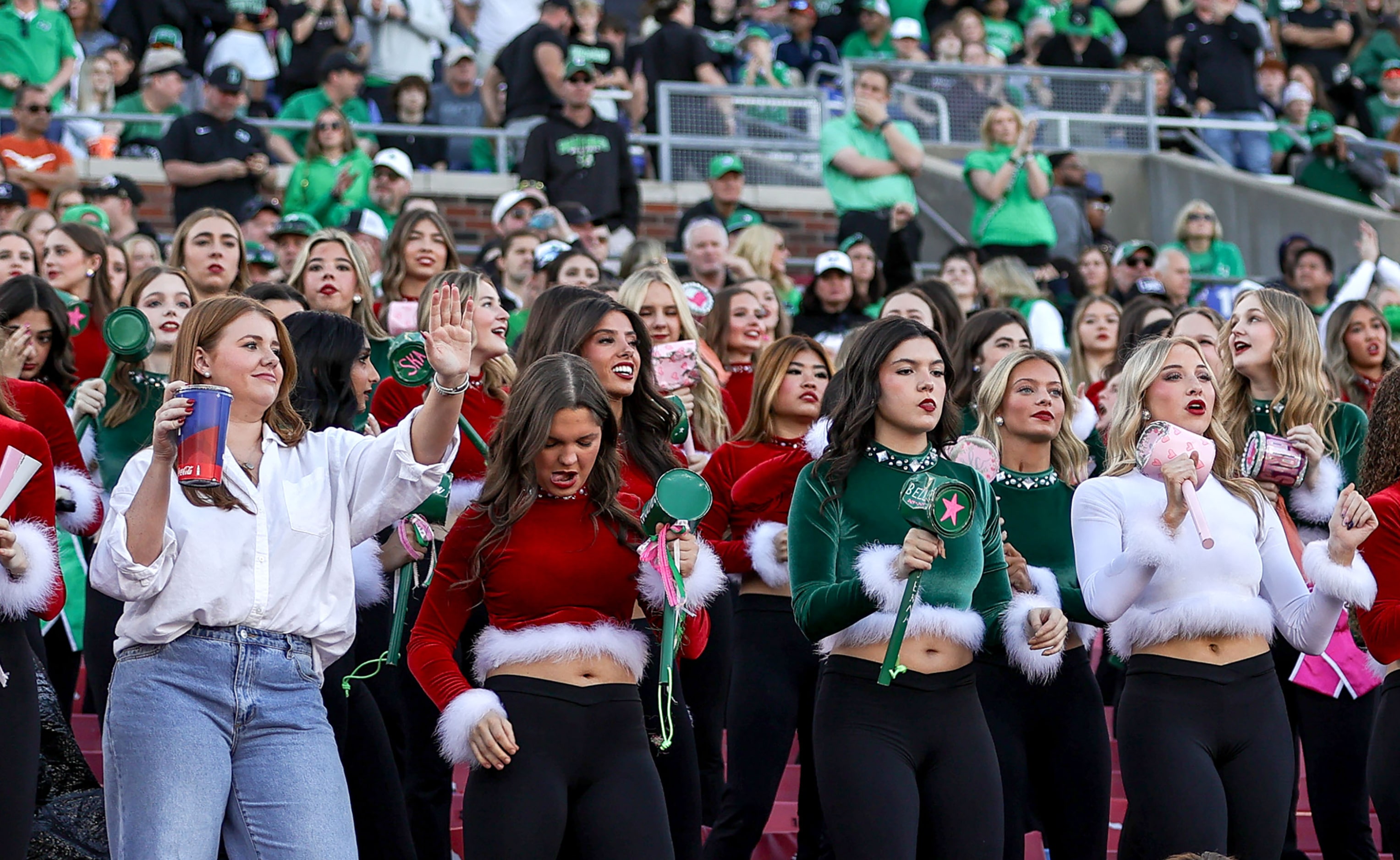 The Southlake Carroll students cheer on their Dragons against Longview in a Class 6A...