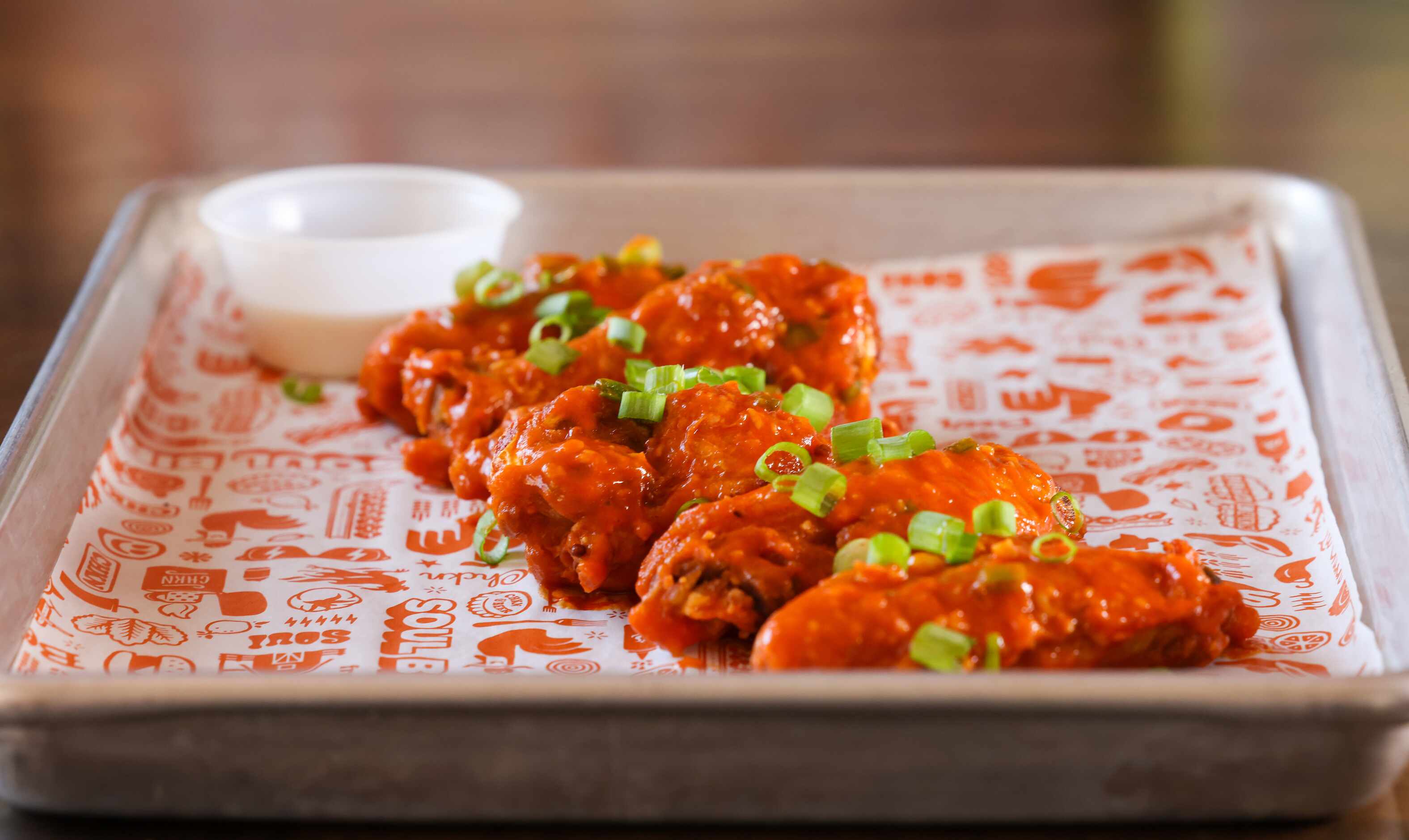 Soul Bird menu options includes wings, served in sizes of six wings or nine, displayed at...