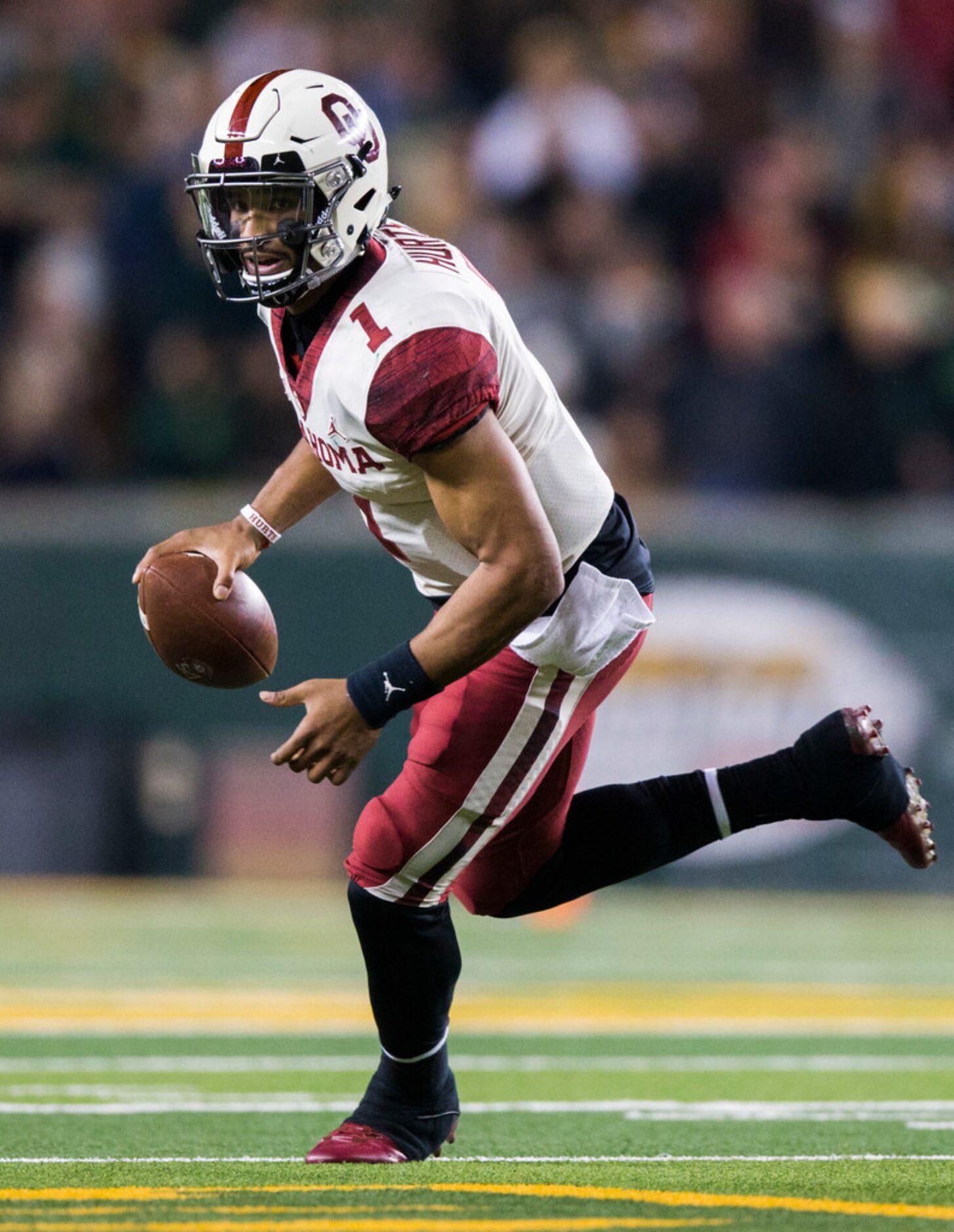 Oklahoma Sooners quarterback Jalen Hurts (1) runs the ball during the fourth quarter of an...