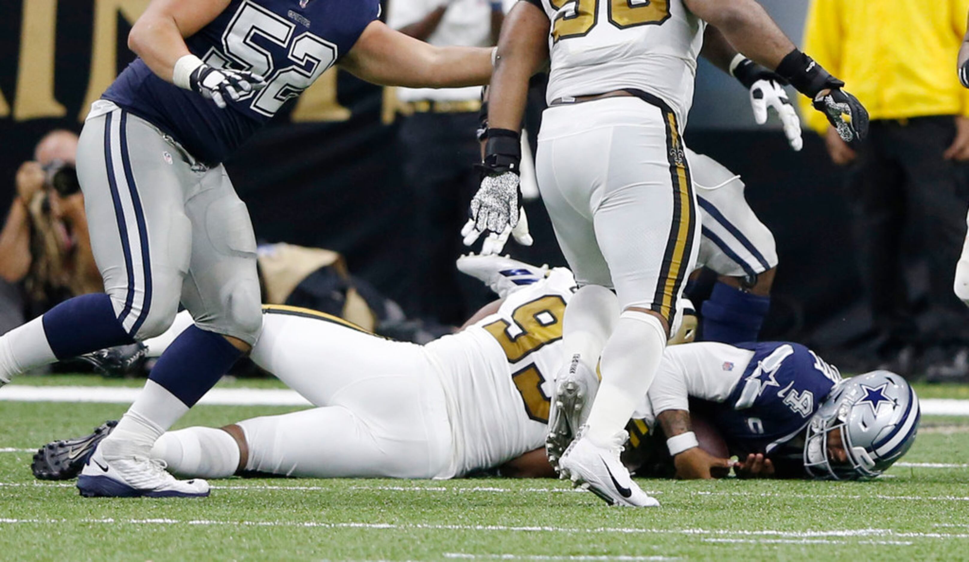 Dallas Cowboys quarterback Dak Prescott (4) is sacked by New Orleans Saints defensive tackle...